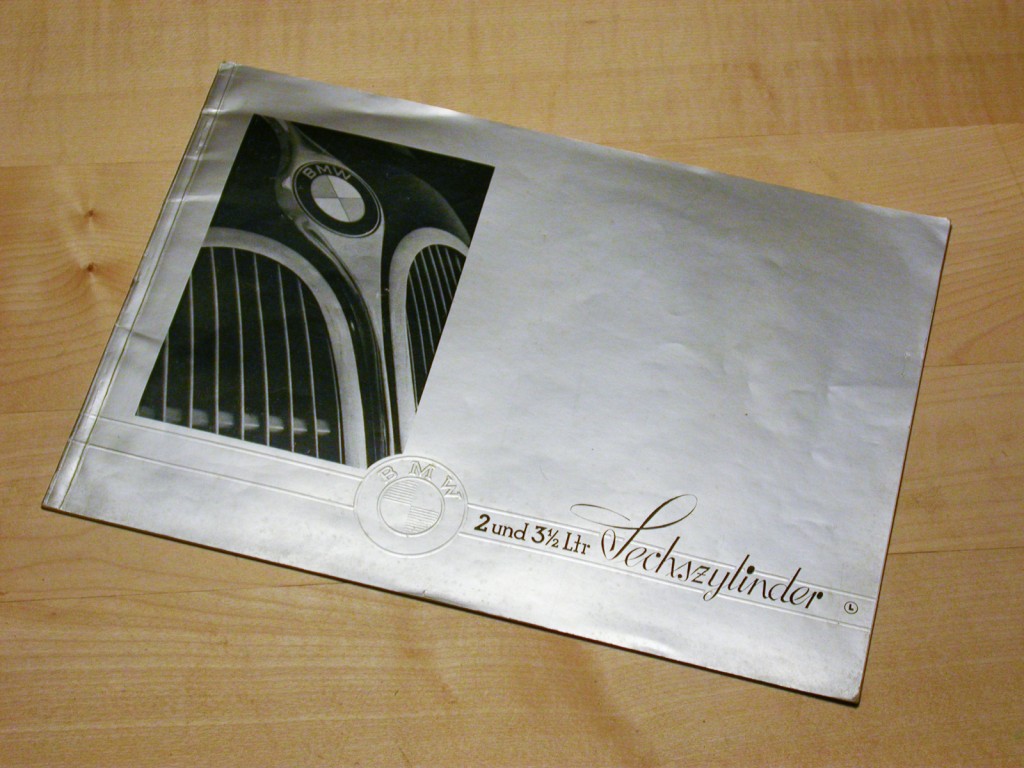 The cover is silver in color, the BMW logo is embossed.